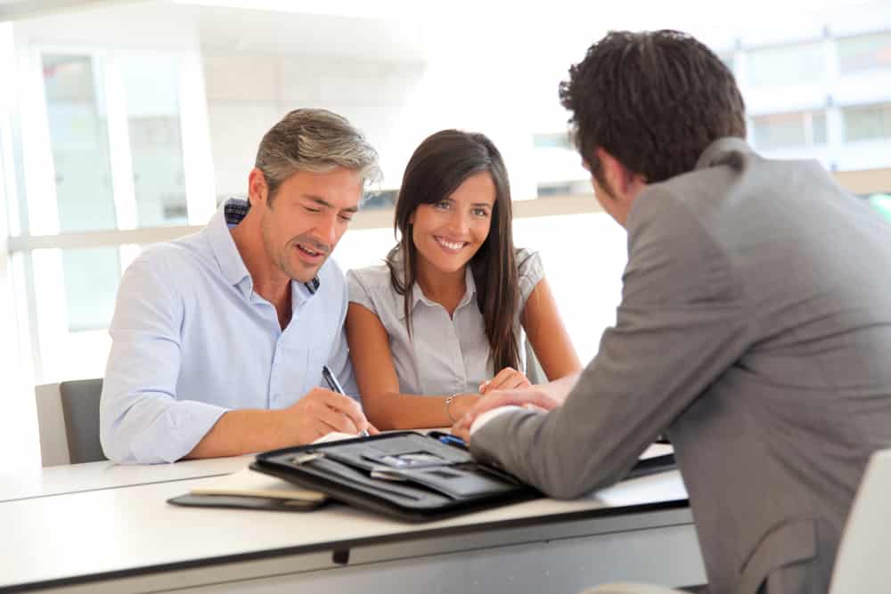 Couple signing mortgage contract