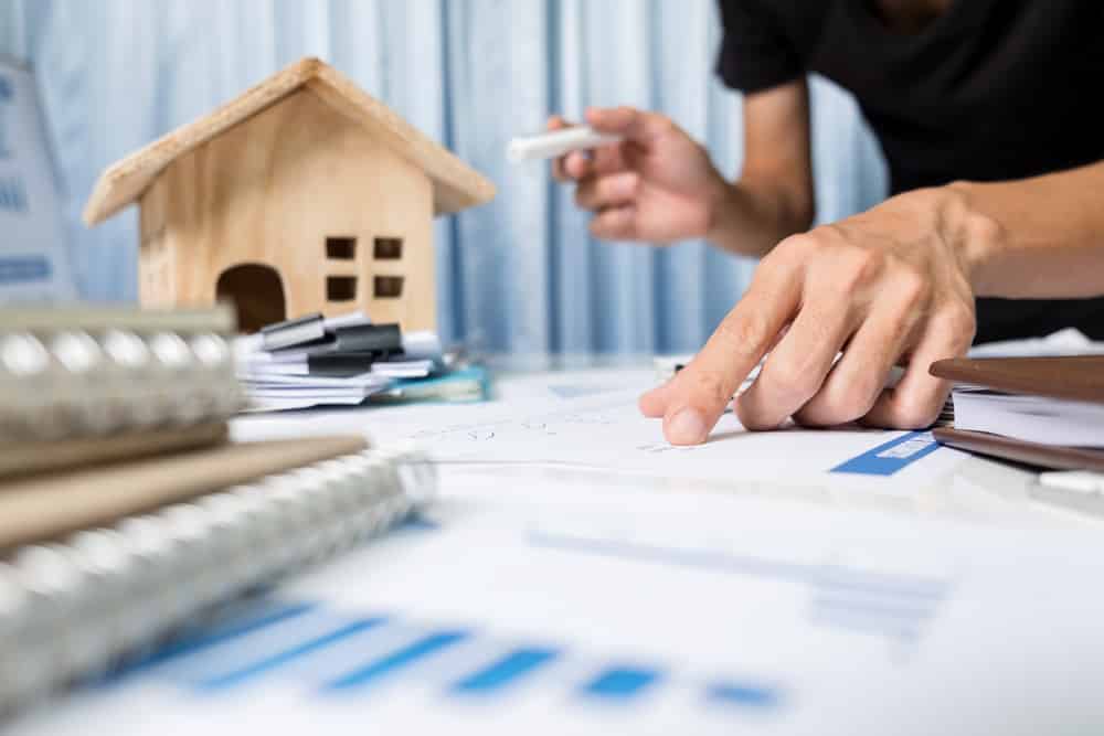 Manager working in the office ,property for sale concept. Mortgage Buying Company